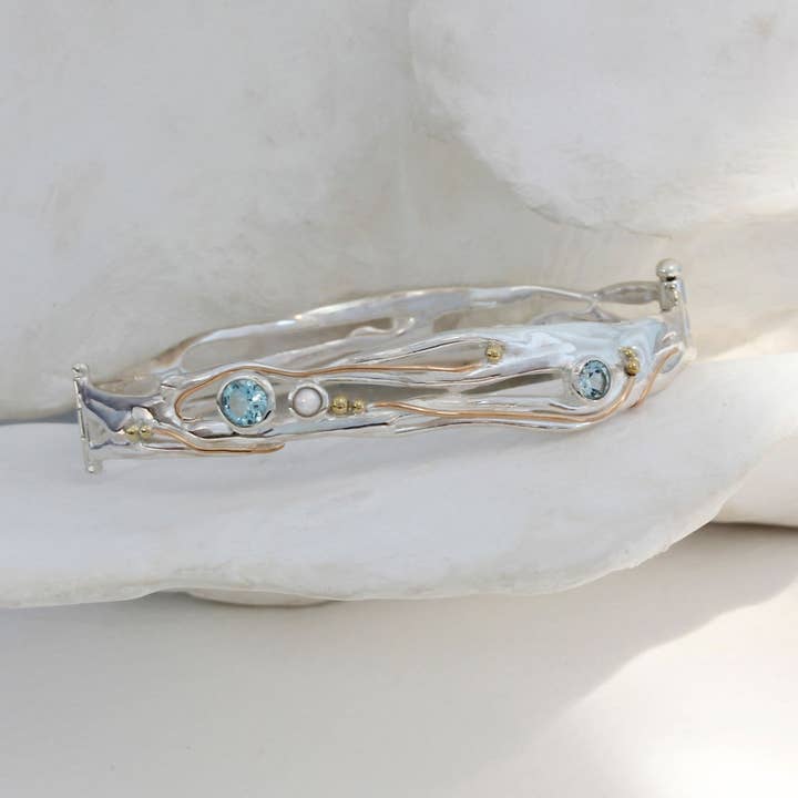 Handmade Sterling Silver Blue Topaz and Pearl Hinged Bangle for wholesale by Banyan Jewellery