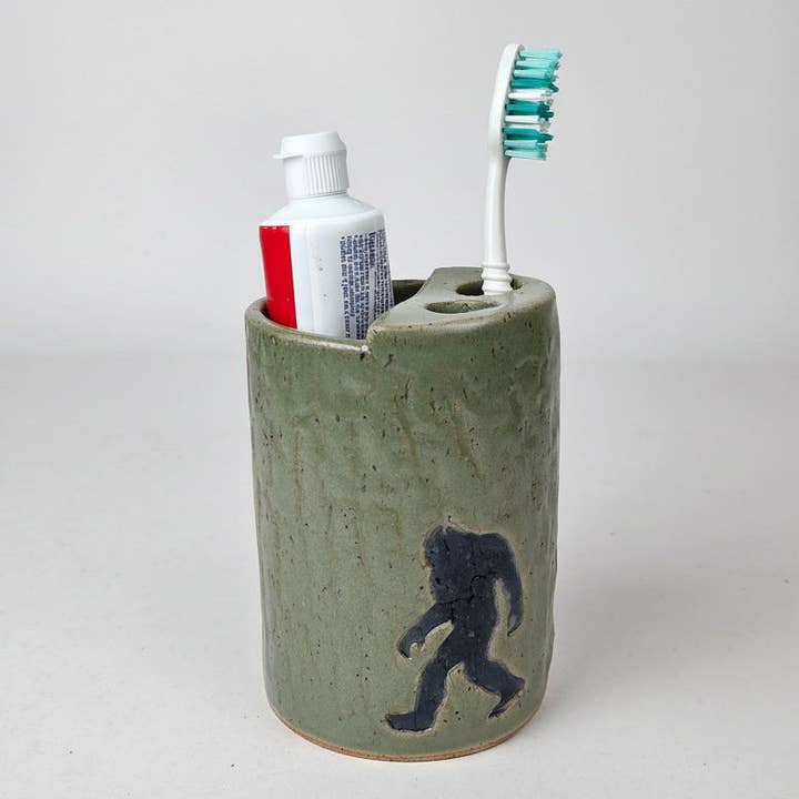 Sasquatch/Bigfoot Handmade Green Stoneware Toothbrush Holder for wholesale by White Squirrel Clayworks