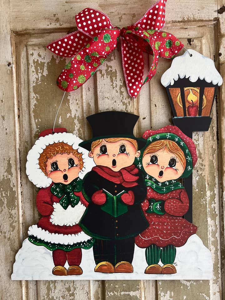 Large Christmas Door Hanger: Carolers for wholesale by The Happy Butterfly