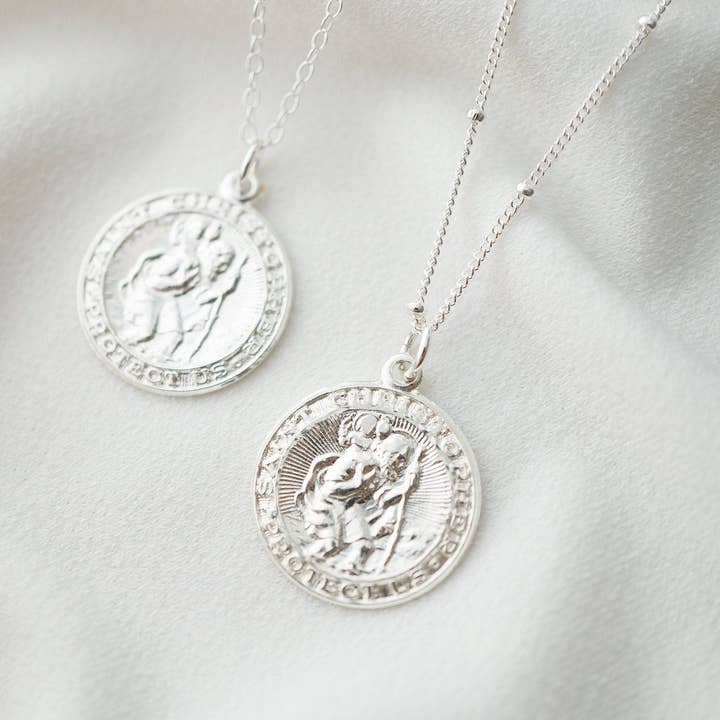 St. Christopher Traveler's Protection Silver Coin Necklace and other Purchase Wholesale st christopher. Free Returns & Net 60 Terms on Faire trending on Faire.