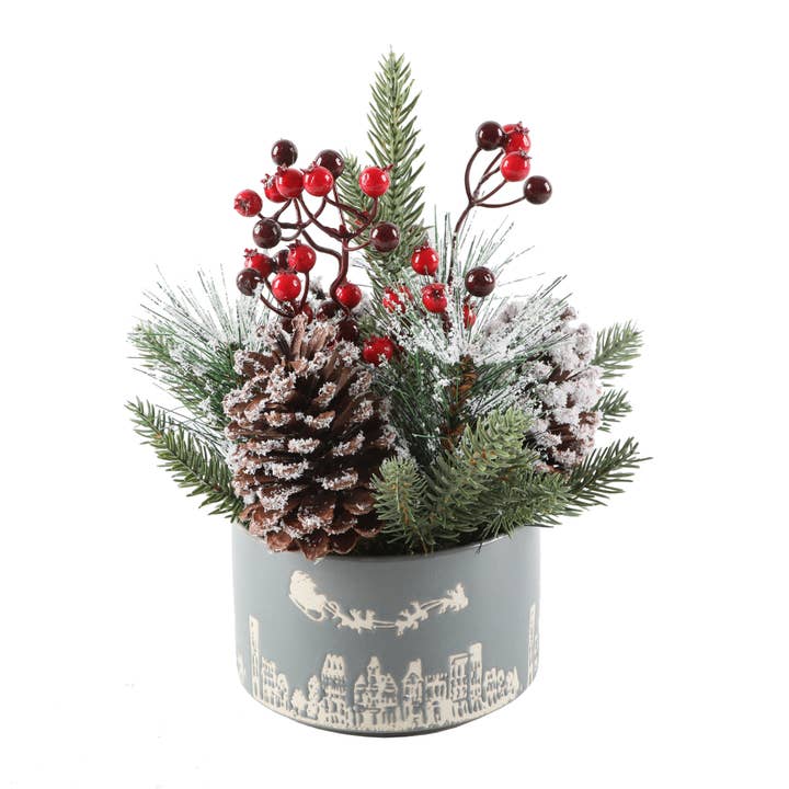 Snowy Pine & Berry Arrangement in Santa Skyline Pot for wholesale by Flora Bunda Inc