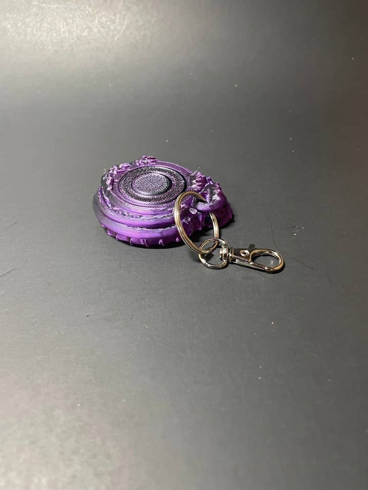 Llavero giratorio con forma de dragón: Twist & Turn para venta al por mayor de Alley Cat Compositions