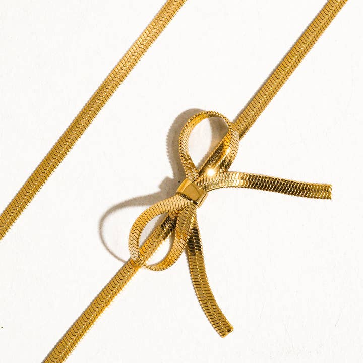 Marie 18K Gold Non-Tarnish Flat Snake Bow Choker for wholesale on Faire