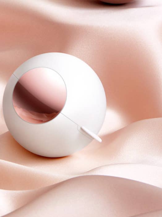 Stick With Me Travel Lint Roller Ball in White for wholesale by Avenue Wholesale