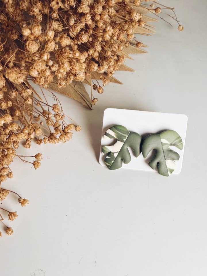 Monstera Albo Stud || Dark Leaf Half Moon for wholesale by The Butterfly Effect