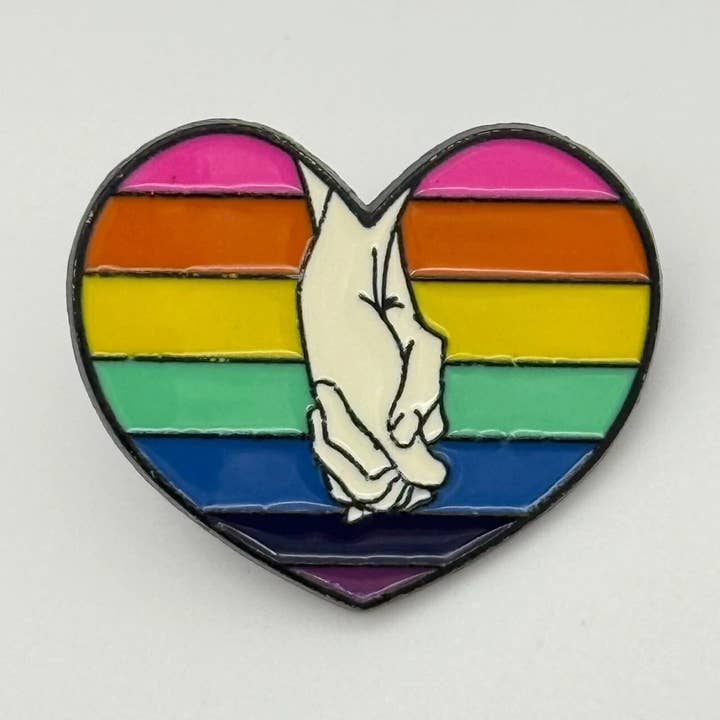 Holding Hands Pride Enamel Pin – Rainbow Heart “Love Is Love” Accessory for wholesale by CY Design Studio