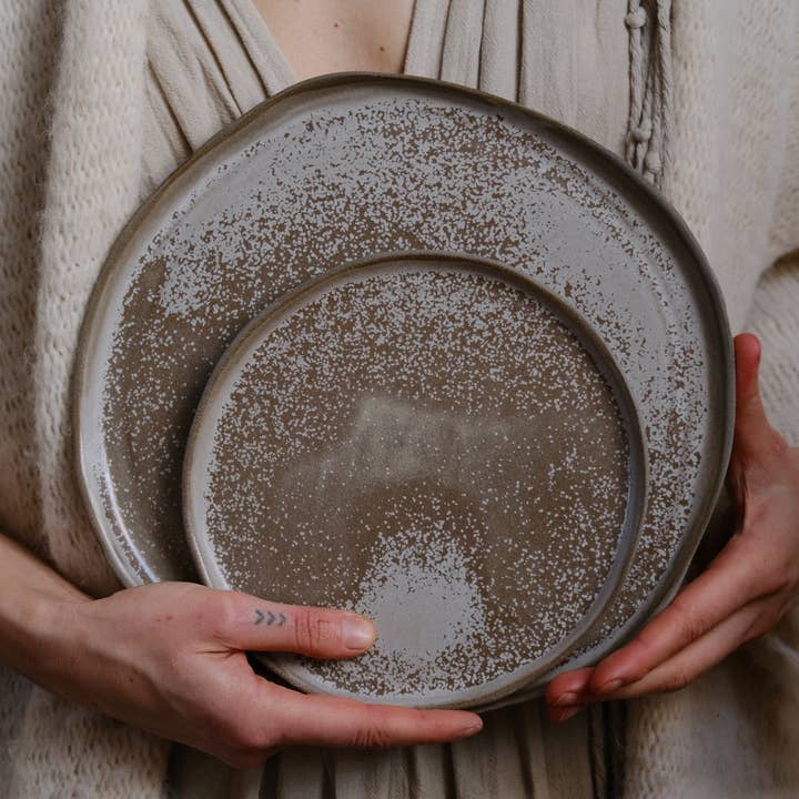 STONEWARE NorthernLights handmade plates and bowls in brown for wholesale by LAIMA CERAMICS (SIA Radosa Apvieniba Spares)
