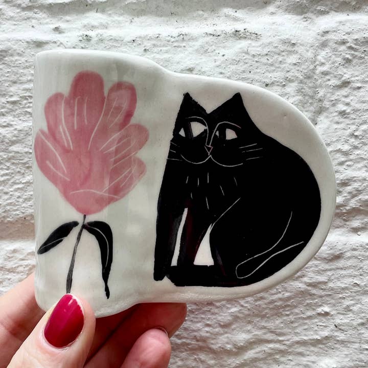 The cutest candle holder, hand built and illustrated for wholesale by Anna Soba