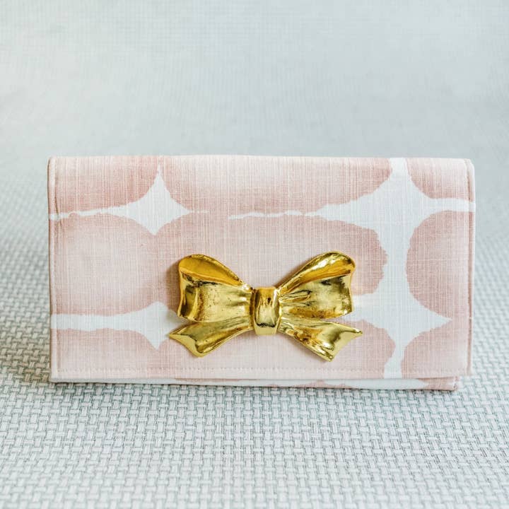 Pink and White Abstract Clutch with Gold Bow Hardware for wholesale by Garland