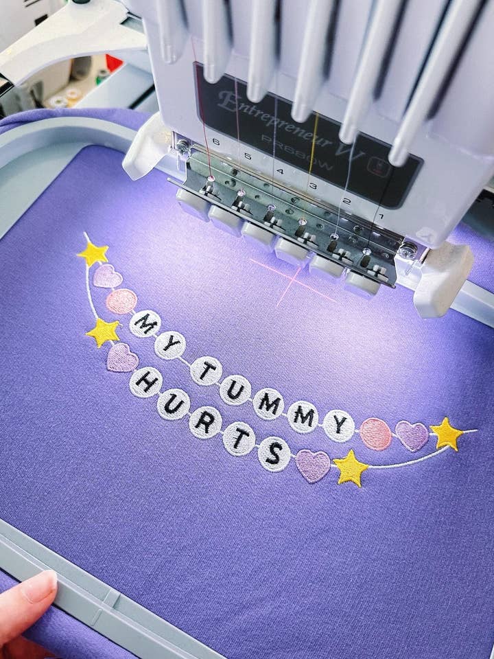 Tired Girl Apparel - Wholesale Sweatshirt - Women's - My Tummy Hurts Friendship Bracelet embroidered crewneck sweatshirt