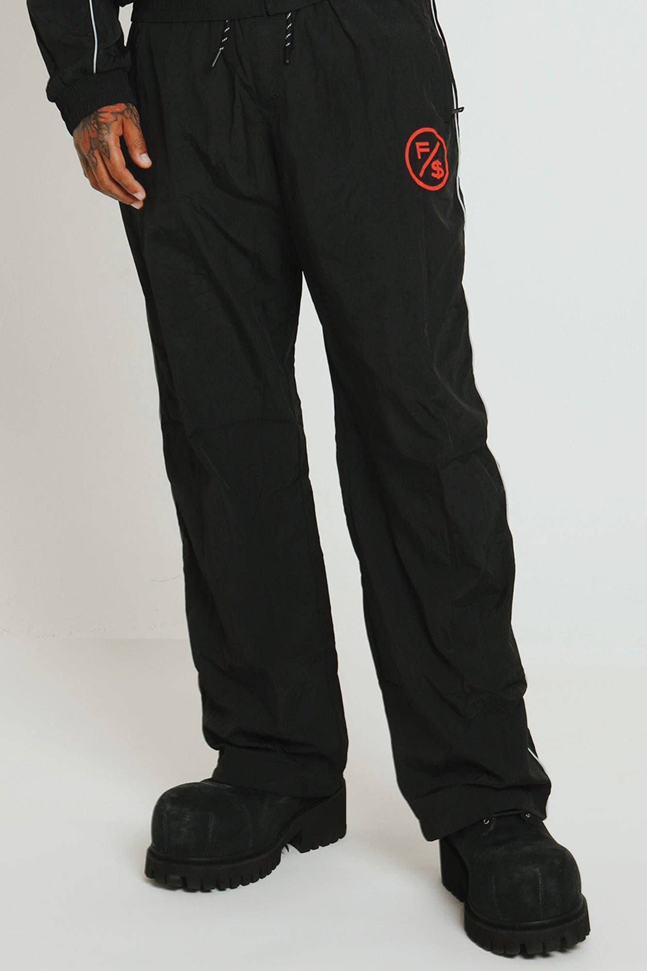 Black Red MOTION Nylon Pants (BRED) for wholesale on Faire2