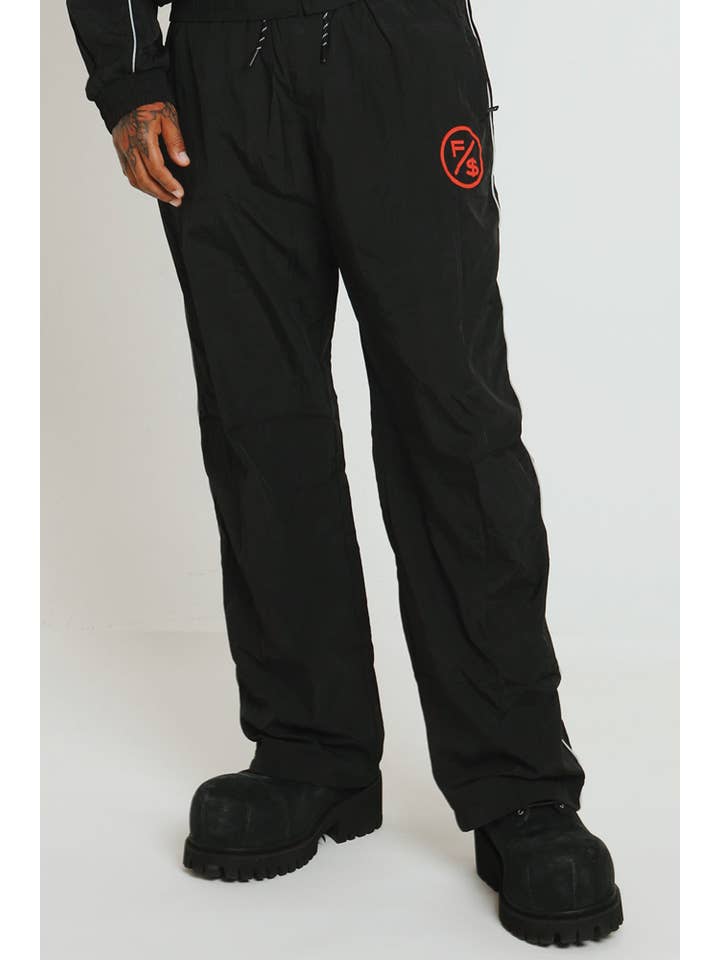 Black Red MOTION Nylon Pants (BRED) for wholesale on Faire2