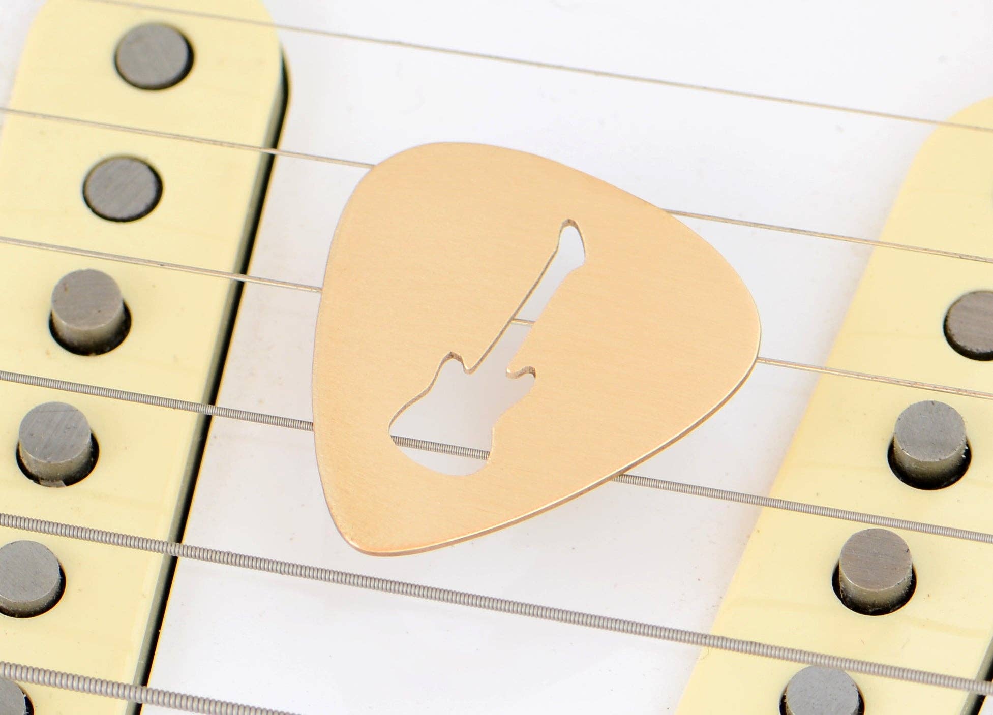 NiciArt LLC - Wholesale Music Accessory - Guitar Pick rocking out a Guitar Cut Out in Bronze0