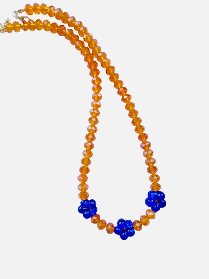 3 Donkerblauwe Bloemen & Oranje 8mm Kralen voor wholesale door Le Club Olive