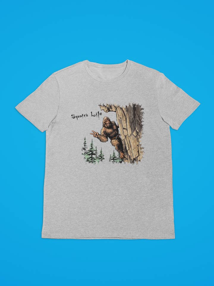 Squatchin’ Country - Wholesale T-Shirt (Graphic) - Unisex - Squatch Life Rock Climbing Bigfoot grey t-shirt