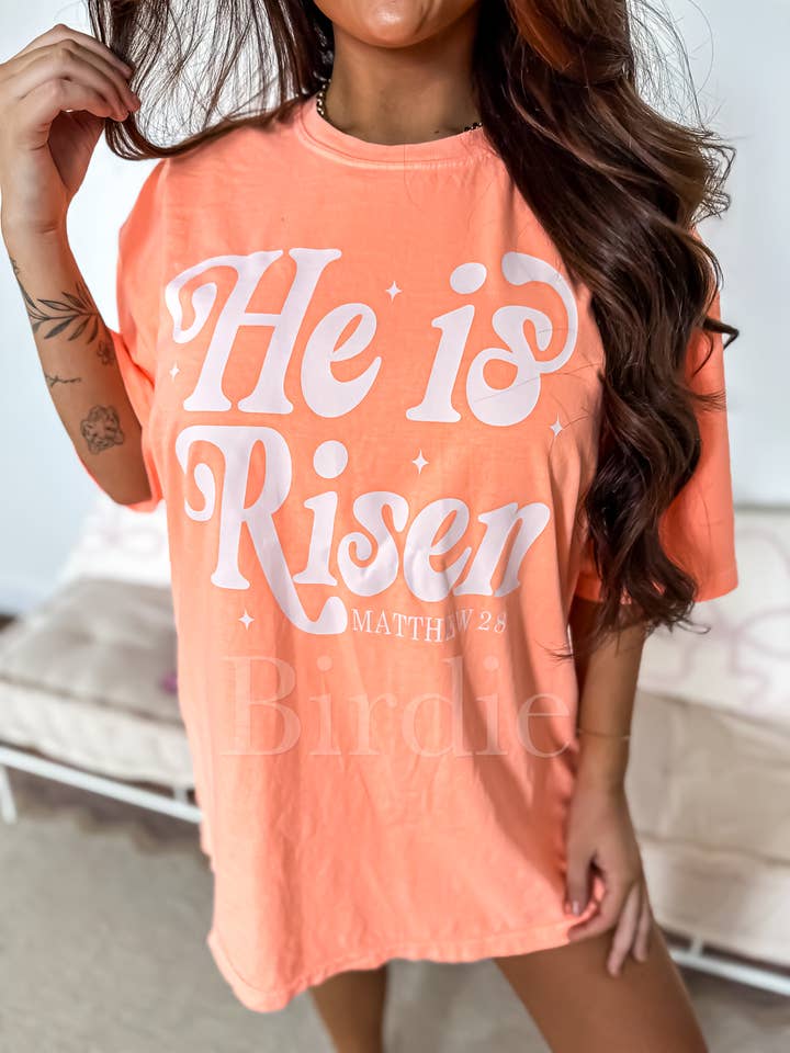 He Is Risen Graphic Tee on Neon Cantaloupe for wholesale by birdie