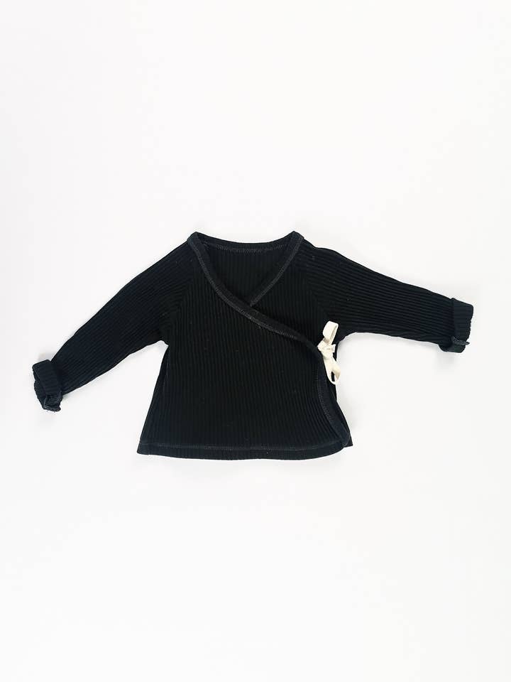 Poudre Økologisk dobbeltradet vest - brugt -3 måneder for engroshandel hos Mademoiselle Bébé