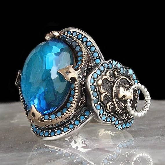Authentic Blue Topaz Ring with Lion Faces for wholesale by Ephesus Jewelry