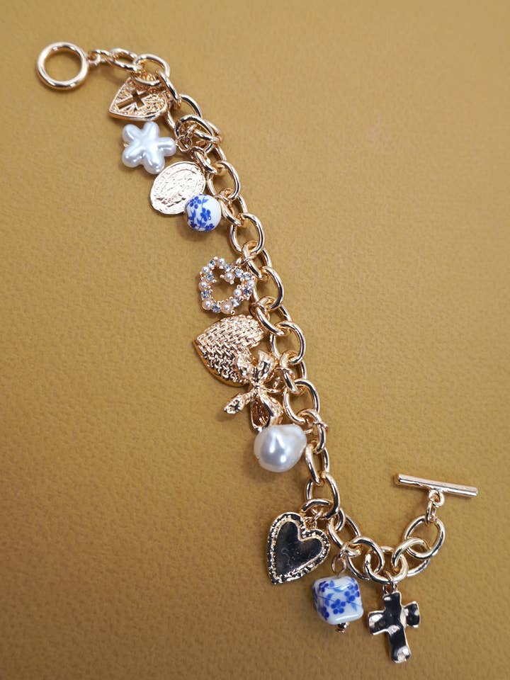 CERAMIC PORCELAIN HEART BOW PEARL CHARM BRACELET | 80B1342 for wholesale by JOSSLYN by wall to wall