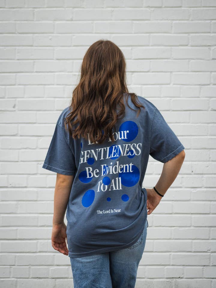 Gentleness Christian T-Shirt | Philippians 4:5 Graphic Tee for wholesale by Salt + Light Design Co.