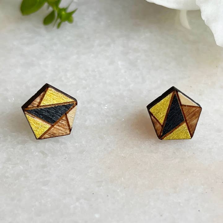 Geometrische puzzelknoppen - zwart en goud voor wholesale door Urban Coyote