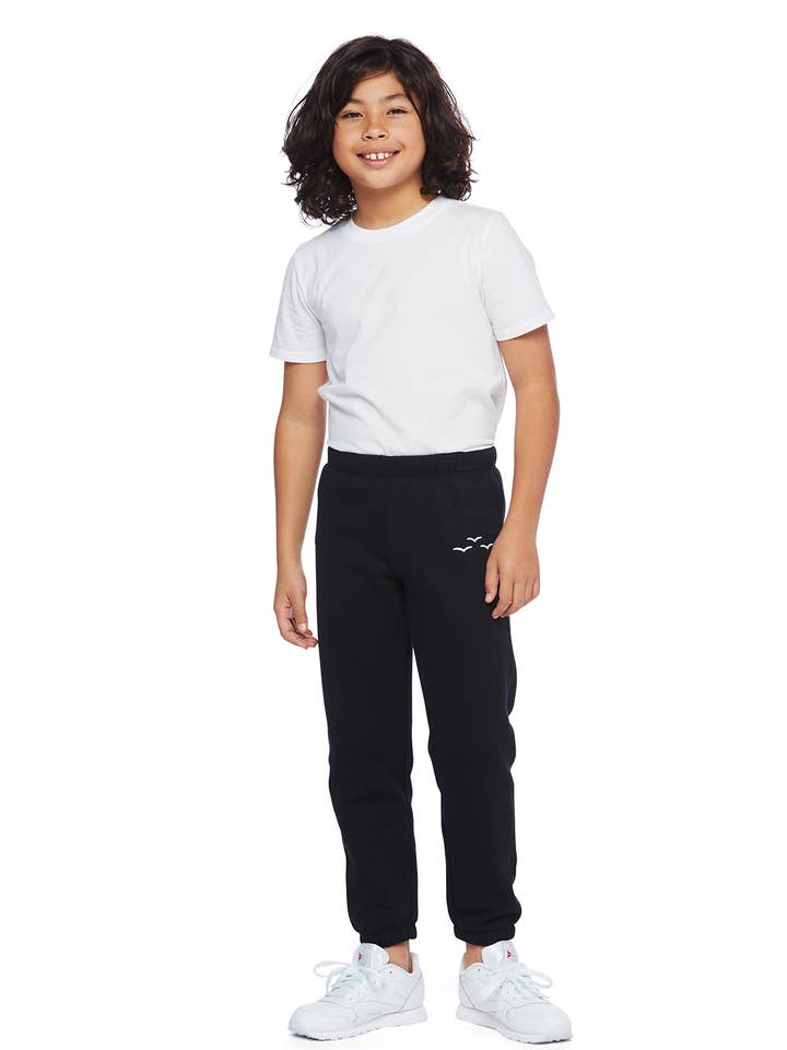 Niki Original Kids pantaloni della tuta in nero per la vendita all'ingrosso da parte di Lazypants