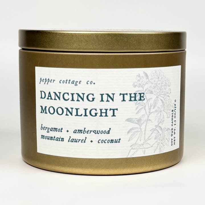 Dancing in the Moonlight 5.5 oz Soy Candle Tin | Bergamot, Amberwood, Mountain Laurel, Coconut | Clean and Citrusy Scented Candle for wholesale by Pepper Cottage Co. Candles