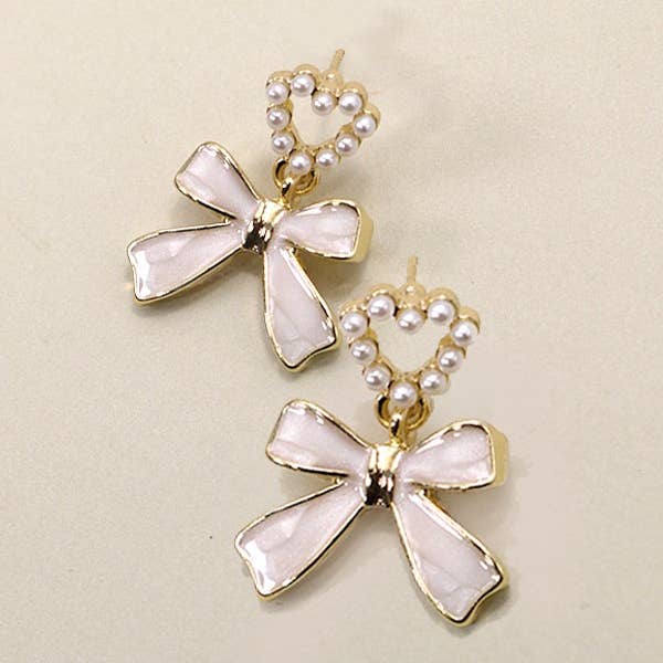 BOW HEART PEARL DROP EARRINGS | 80E3002 and other Purchase Wholesale david bowie earrings. Free Returns & Net 60 Terms on Faire trending on Faire.