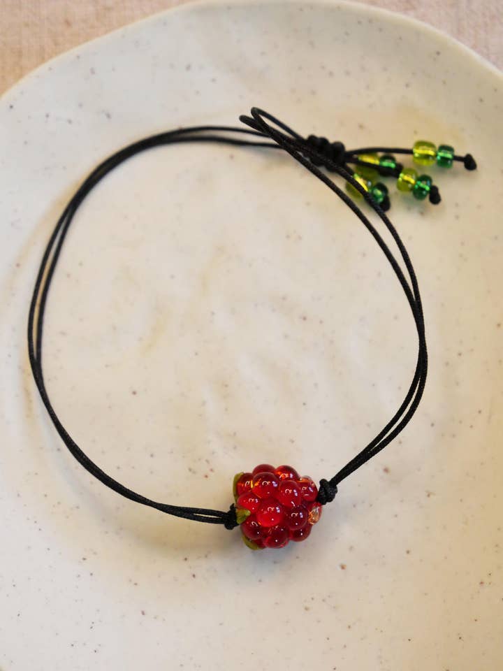 Red raspberry sliding bracelet for wholesale by CHRISTEL BUSSIERE