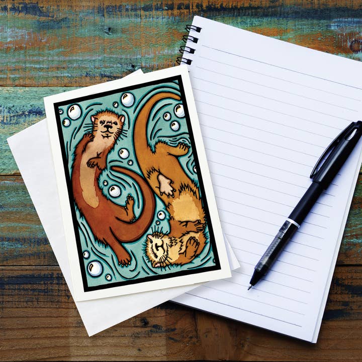 Tarjeta de felicitación Nutrias para venta al por mayor de Sarah Angst Art