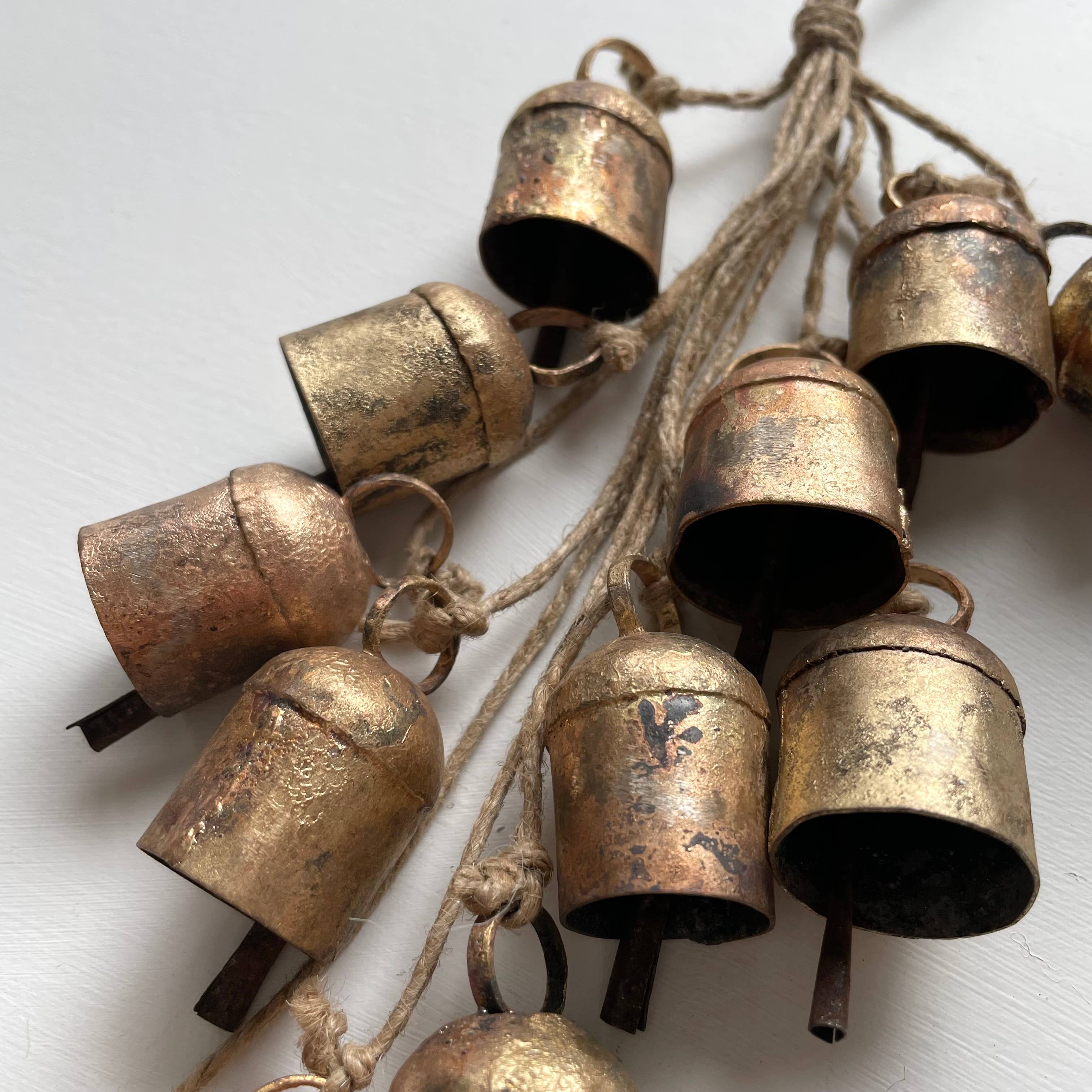 fort & field - Wholesale Ornament - Rustic tin brass cow bell clustered hanging garland on jute1