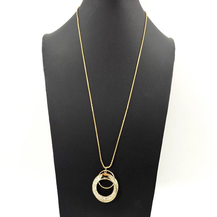 Encased crystal circle pendant necklace on long chain for wholesale by Tempest Designs