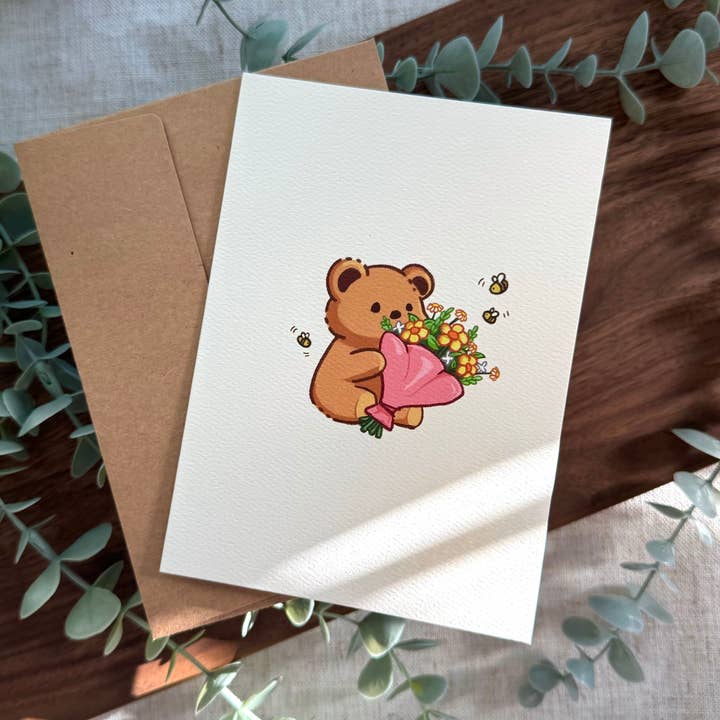 Bear with Flowers Greeting Card for wholesale by Astraea Amour