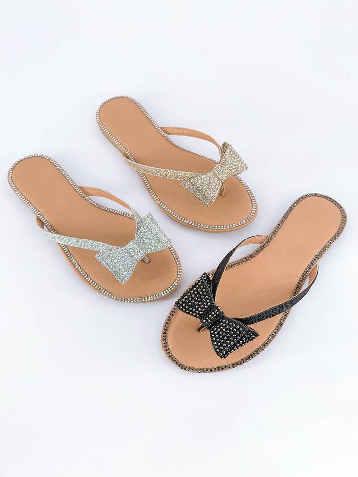 CHAMPAGNE FANNIE JEWELED BLING BOW THONG SLIDE for wholesale on Faire