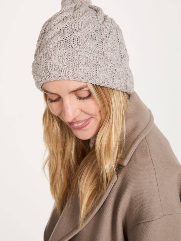 Clifden Cable Aran Hat with Pom Poms - Oat for wholesale by Aran Woollen Mills