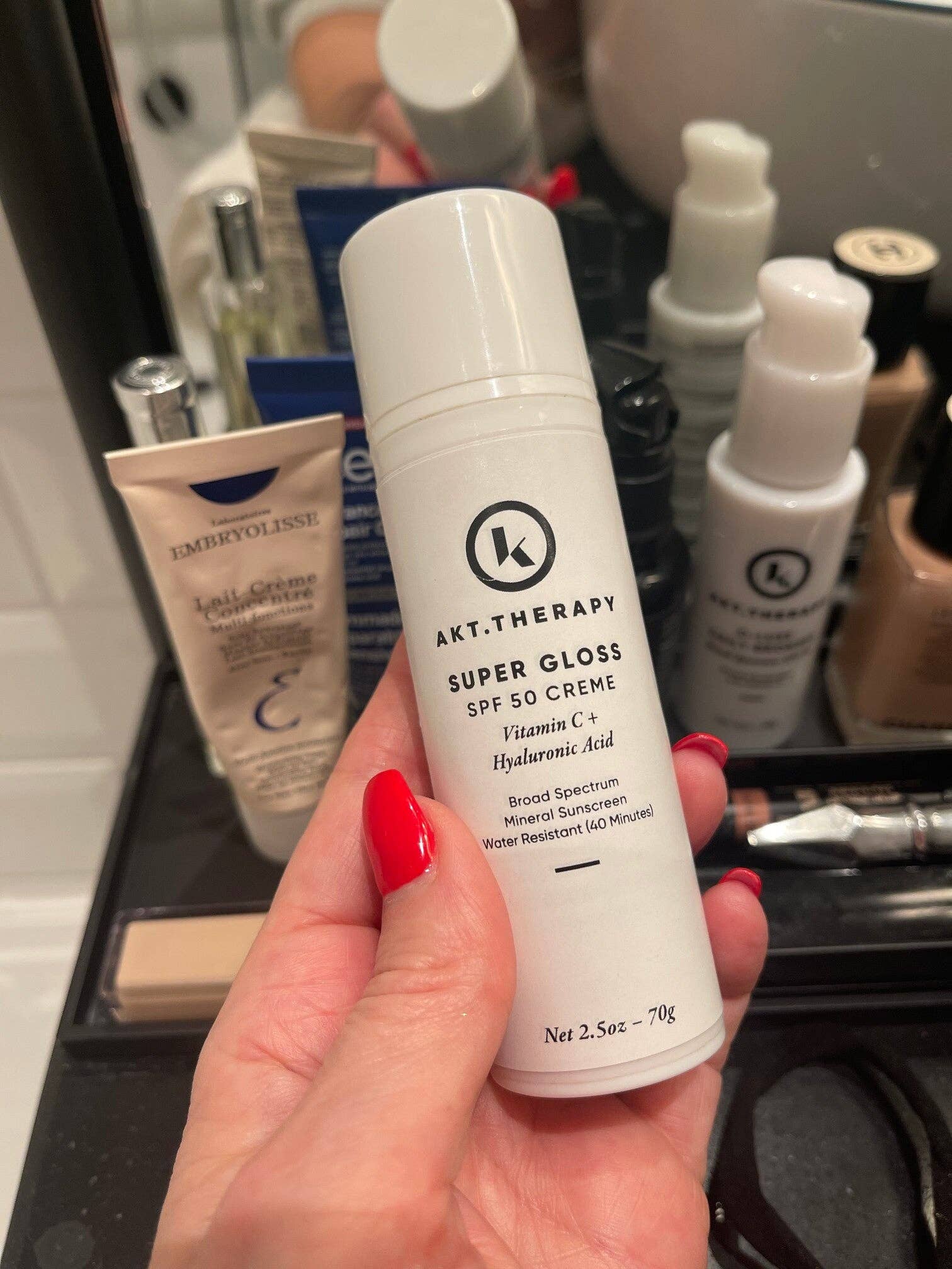 Un tinted Super Gloss SPF 50 Sunscreen for wholesale on Faire2