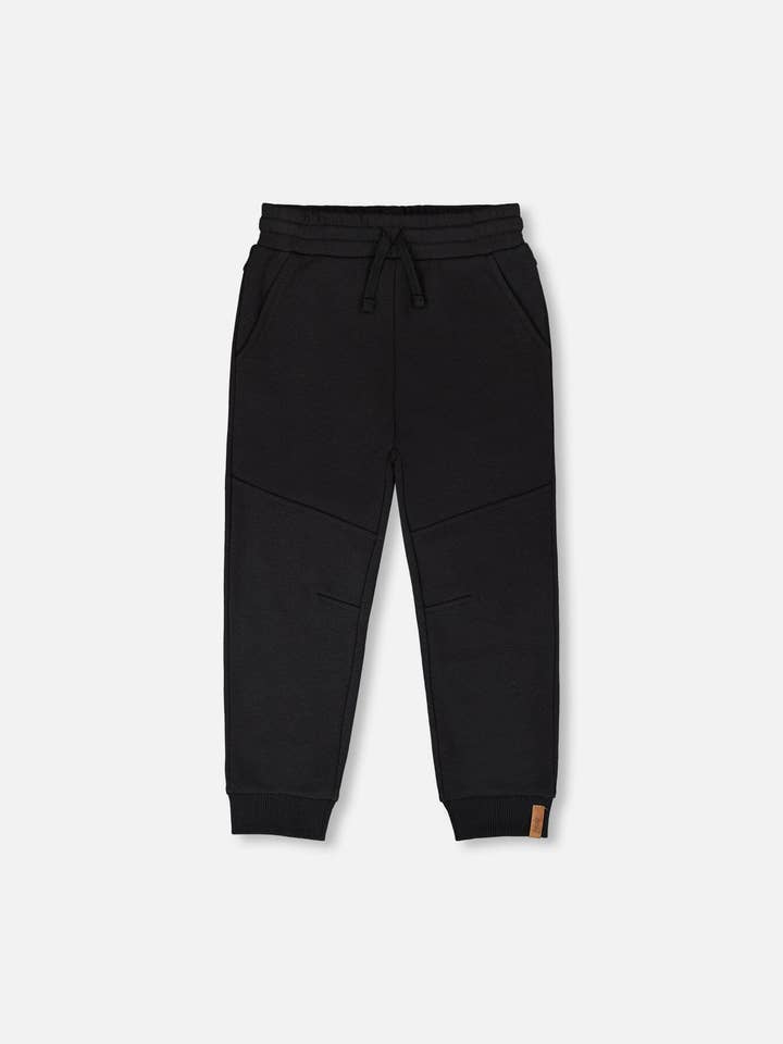 Franske Terry-joggingbukser med krydssømme i sort for engroshandel hos Deux par Deux