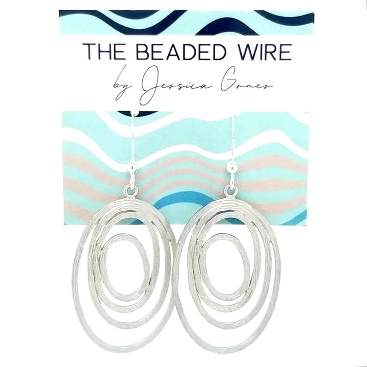 #MM6- Abstrakt Oval Drop- Silver för wholesale av The Beaded Wire Designs