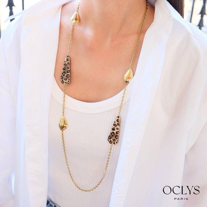 Utali long necklace in gold-plated stainless steel resin and other Purchase Wholesale hielo. Free Returns & Net 60 Terms on Faire trending on Faire.