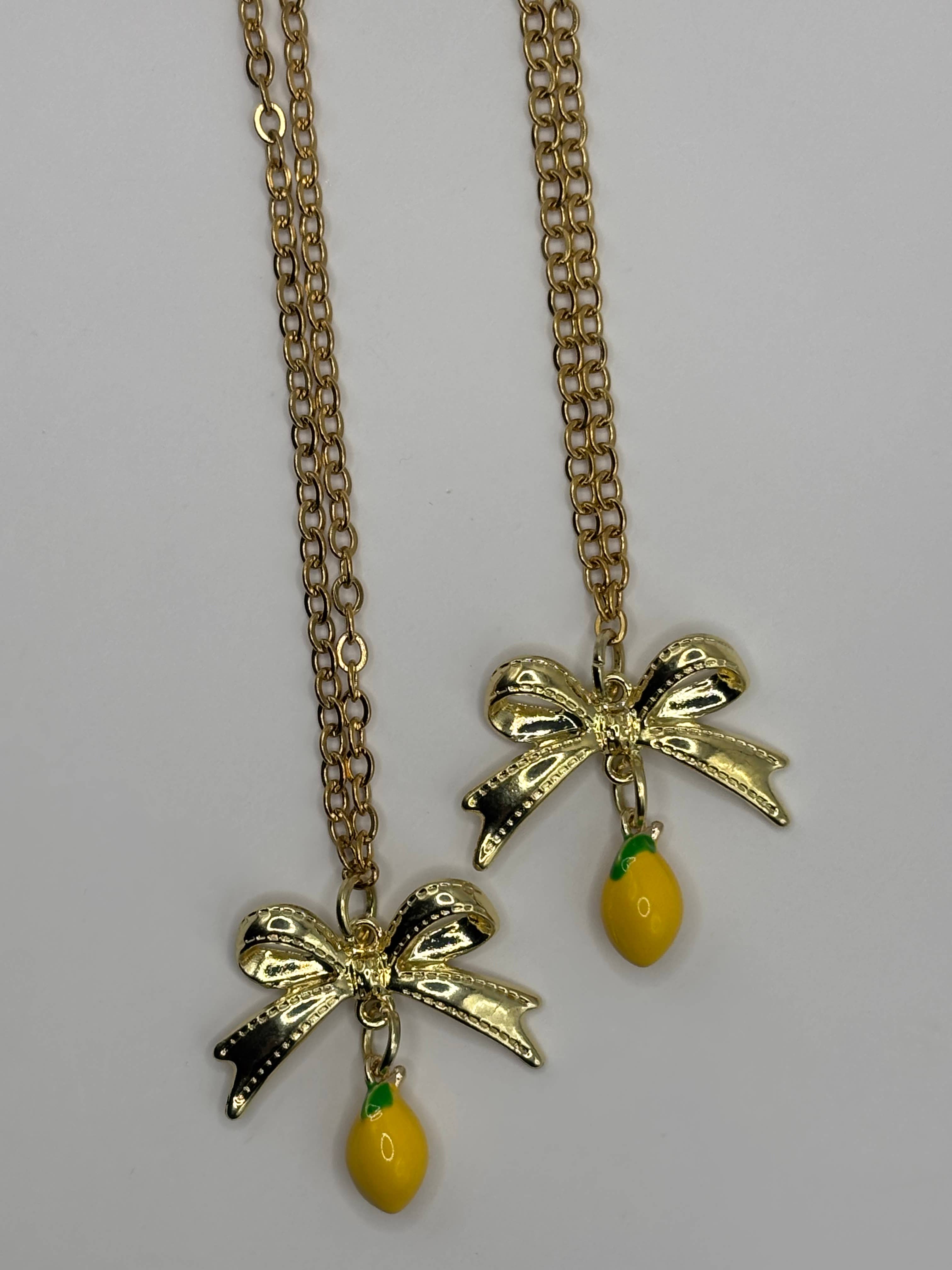 Penny Lane Jewelry Co - Wholesale Pendant/Charm Necklace - Daphne Gold Lemon Bow charm necklace 2