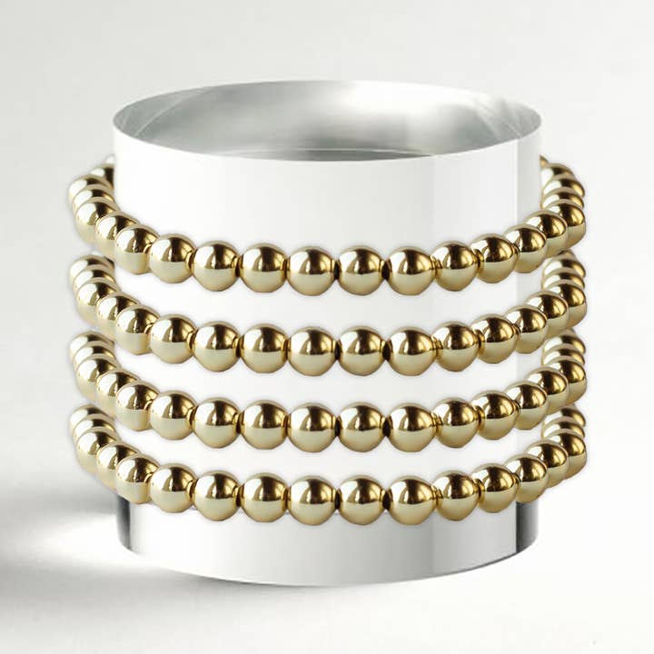 Bracelets à superposer : bracelets empilables dorés de 6 mm, lisses pour la vente par Lenny & Eva