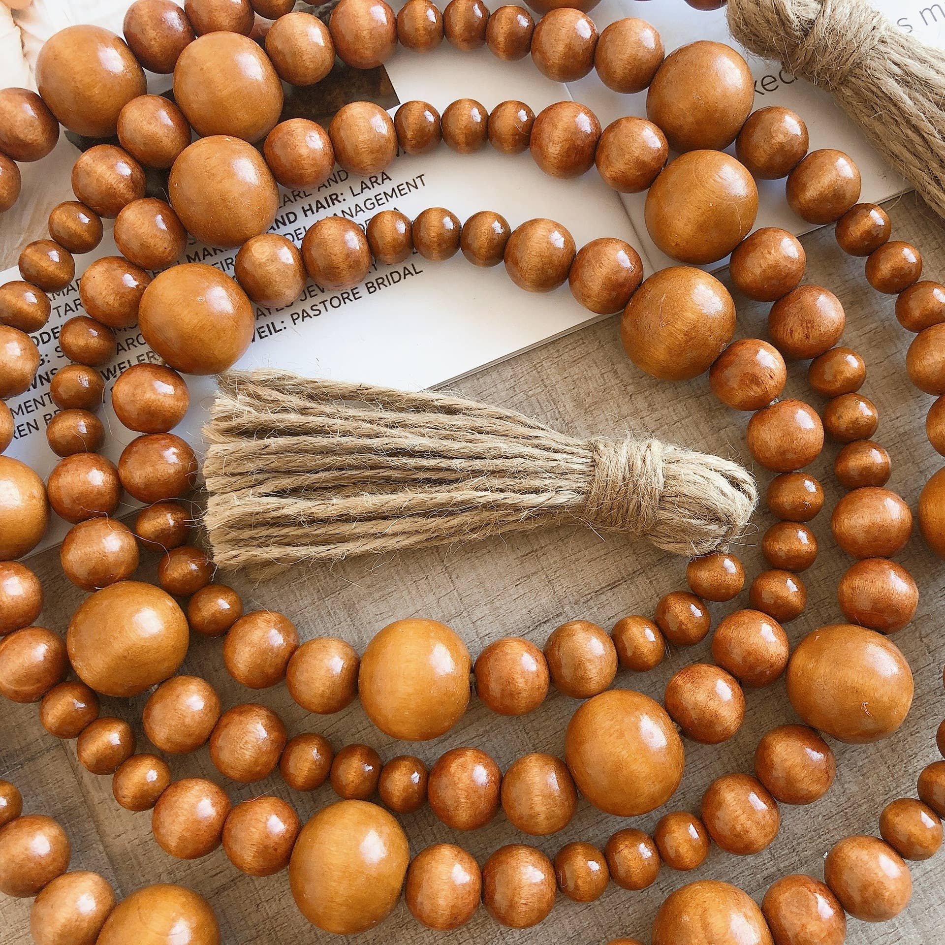 Brown Home Decoration Hemp Rope Tassel Wood Bead String Ornaments for wholesale on Faire3