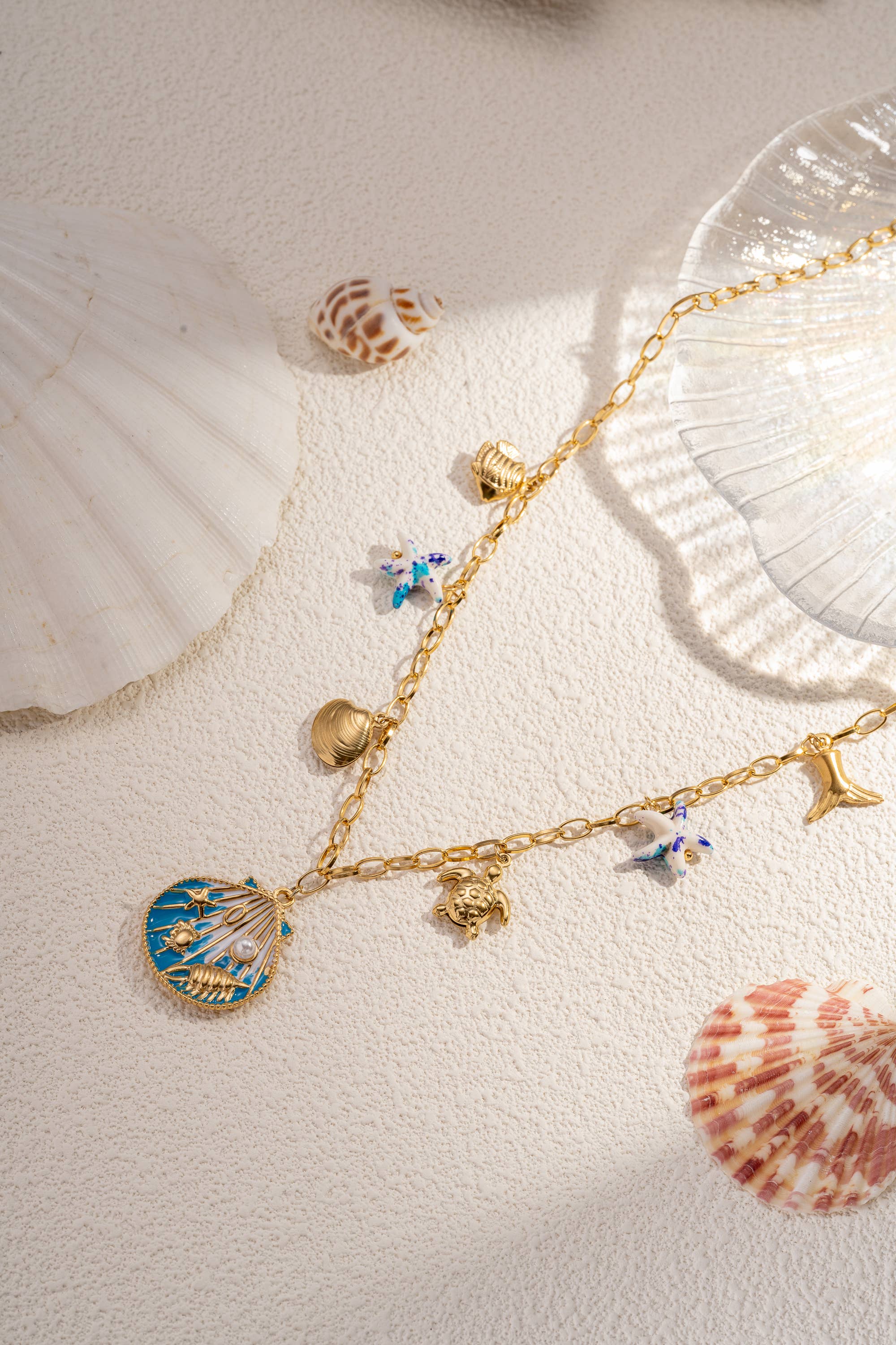 COSMOS – Großhandel Schmucksets – Muschel-Halskette und Ohrring-Set aus Stahl1