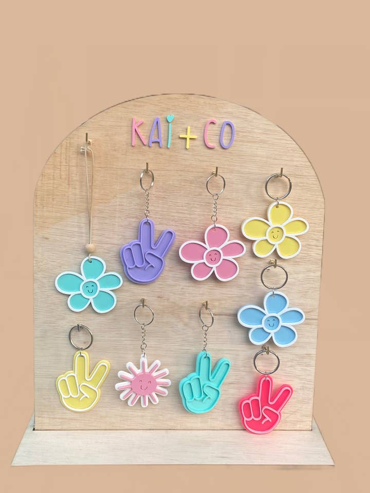 Key Chain / Bag Tag Acrylic Daisy, Sun or Peace Sign for wholesale by Kai and Co