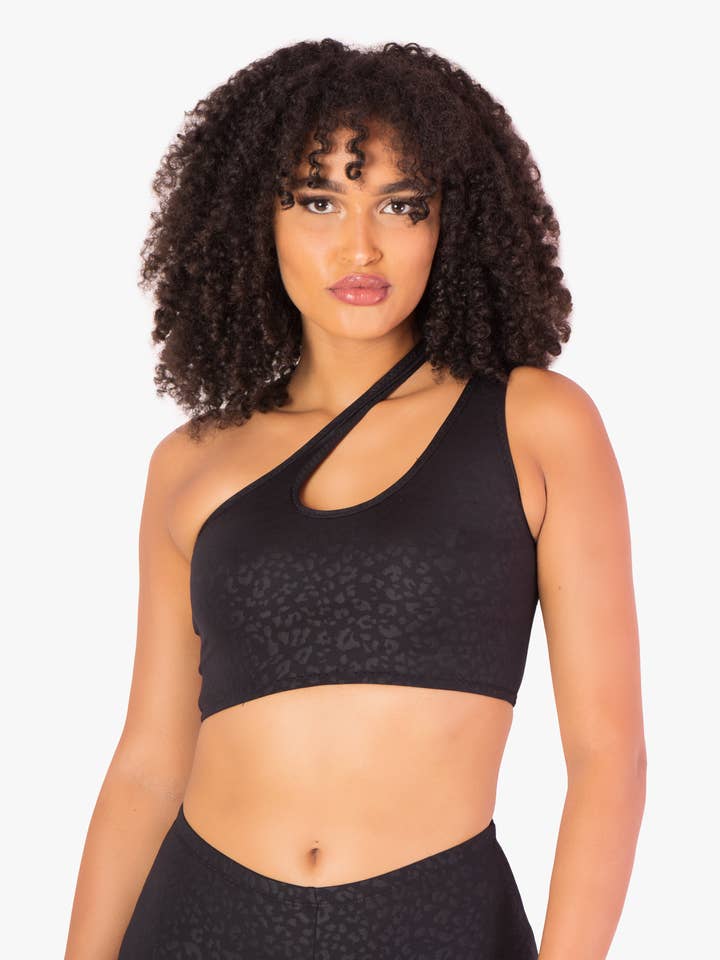 Crop top con taglio asimmetrico leopardato nero per la vendita all'ingrosso da parte di Playsuit Apparel