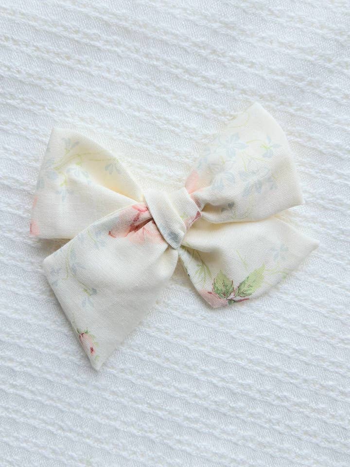 Large Pinwheel Bow on Clip • Cream Floral for wholesale by Revival Bow Co.
