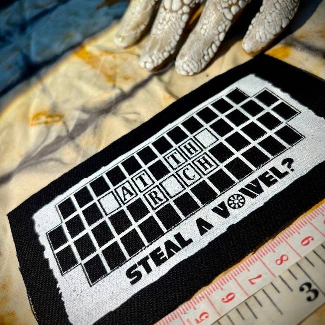 Three Raccoons - Wholesale Patch - Steal A Vowel? Wheel of Fortune style Eat the Rich patch.1