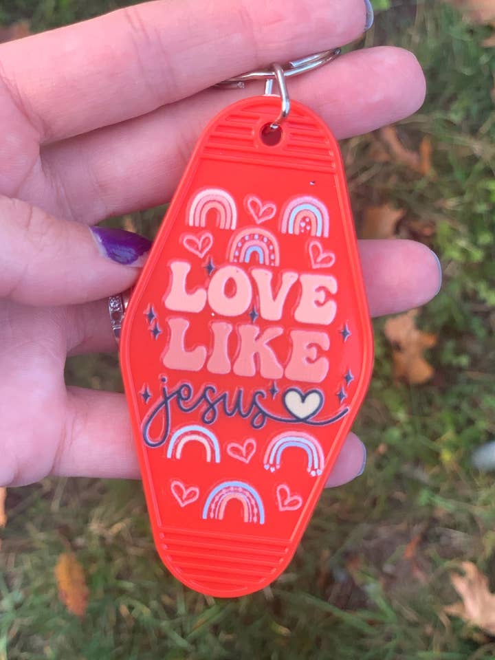 Porte-clés Cadeau Motel Aime Comme Jésus pour la vente par The E Tribe Co.