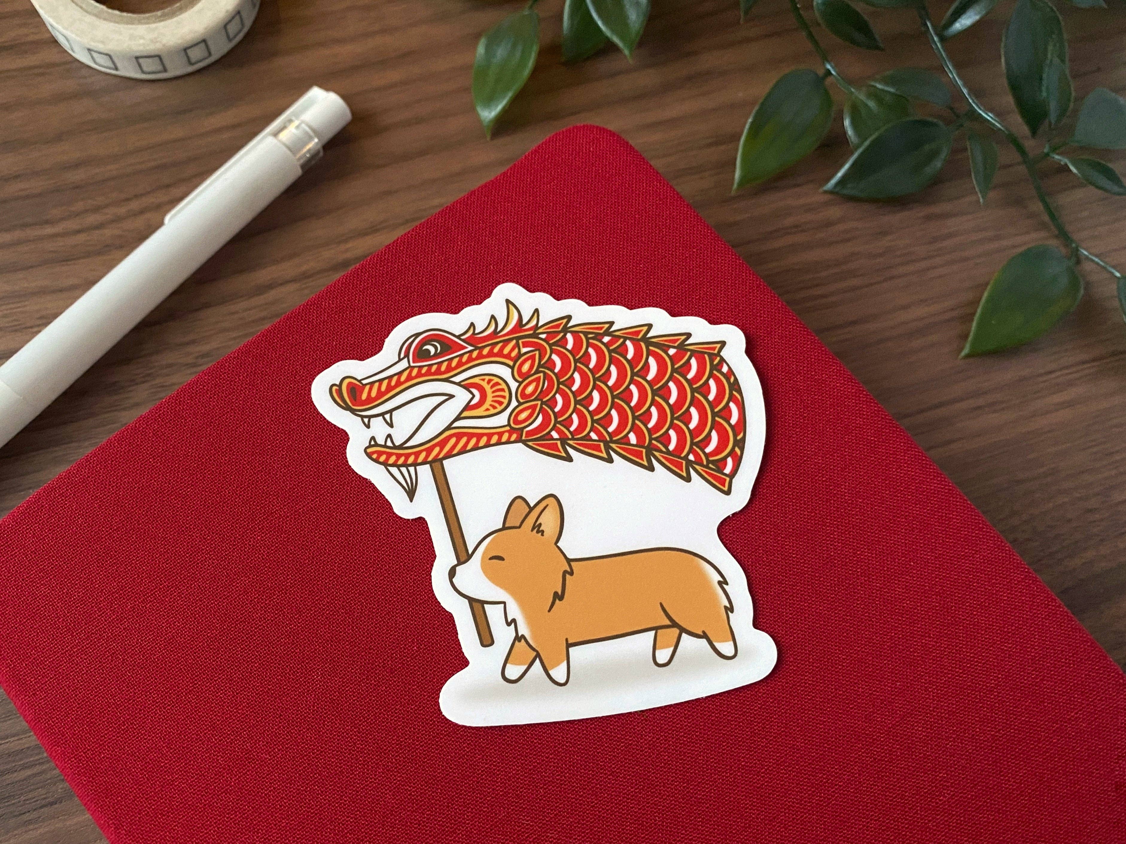 Kela Designs - Wholesale Sticker - Dragon Corgi vinylsticker voor het nieuwe jaar op de maan2