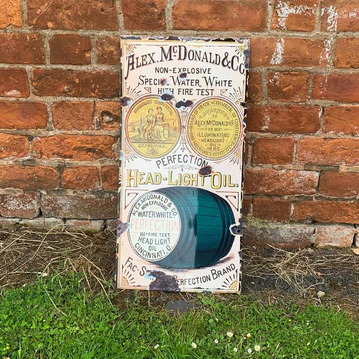 The British Metal Signs Company – wholesale Sign – Head Light Oil 24 Metal Wall Sign